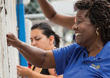 A Rotary member painting during a service project.